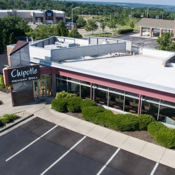 aerial view of the exterior of the Chipotle building and the parking lot